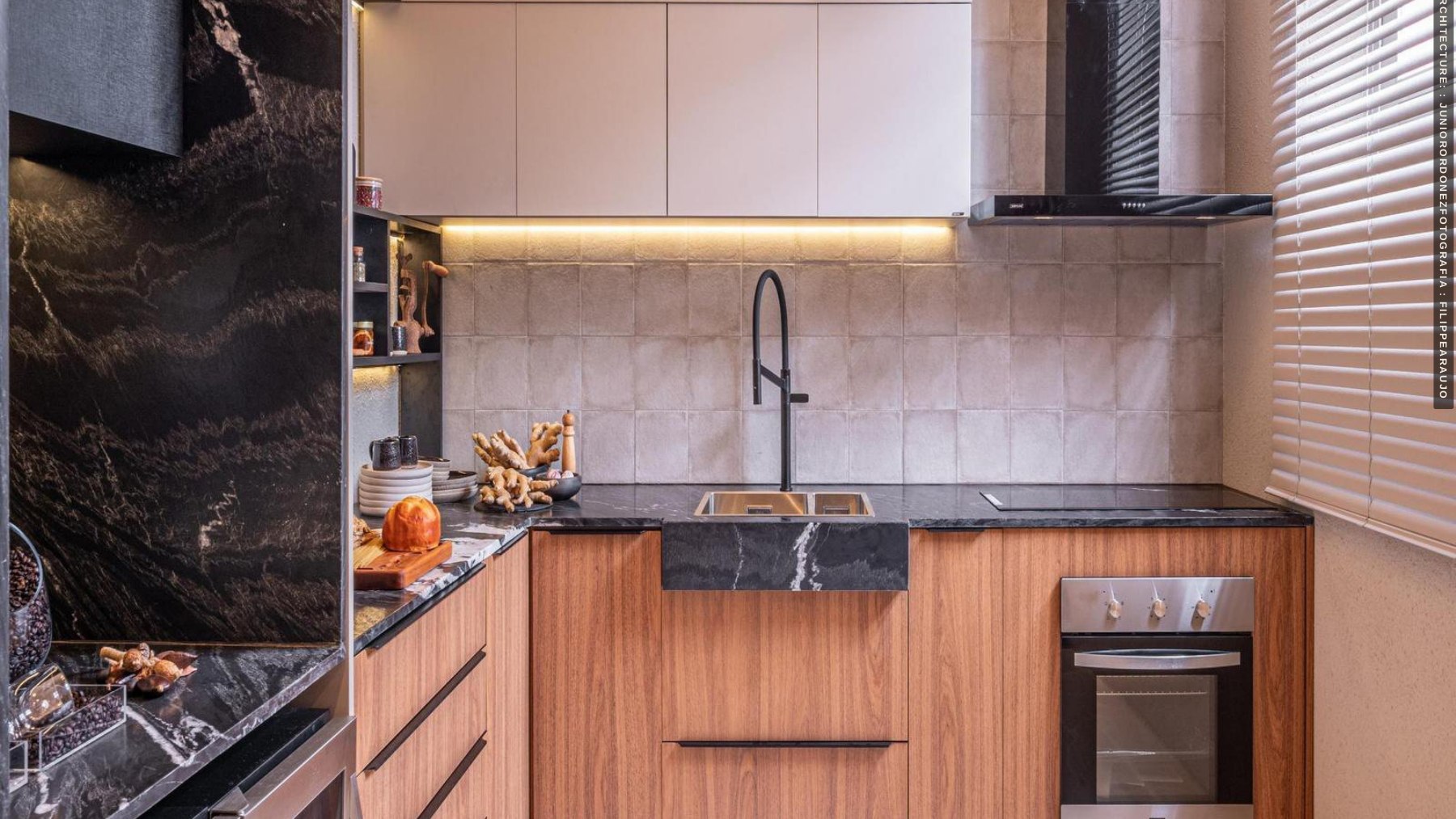 Compact beverage area with wood cabinetry and a stone backsplash