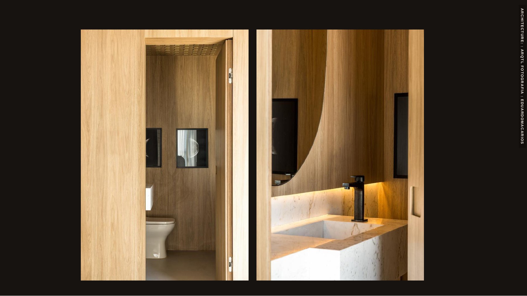 Bathroom with wood paneling and a mirror composition